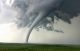 a tornado crossing over an open field